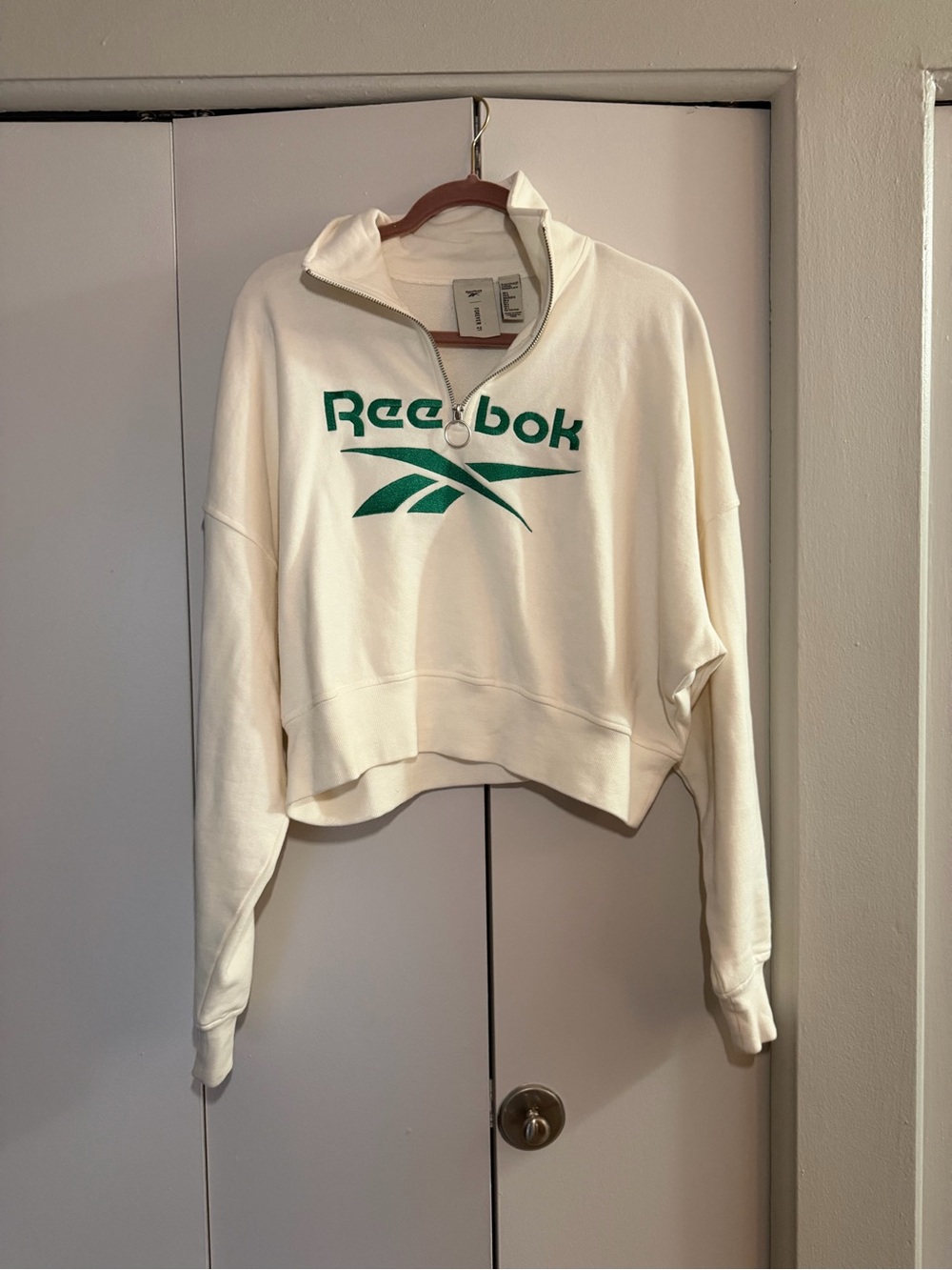 Reebok Cream Cropped Quarter-Zip Sweatshirt with Green Logo